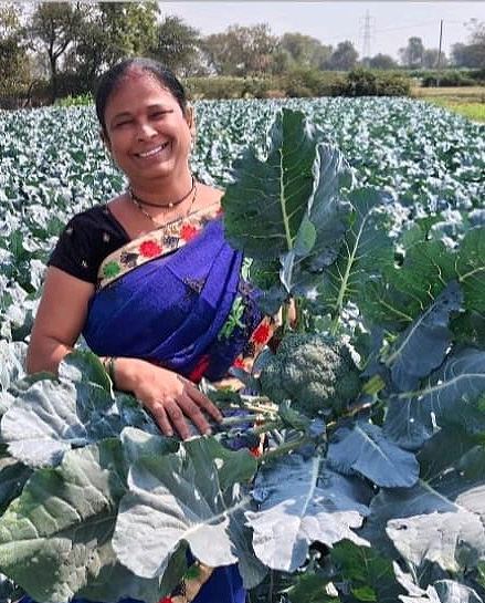 Farmer holding crate of produce